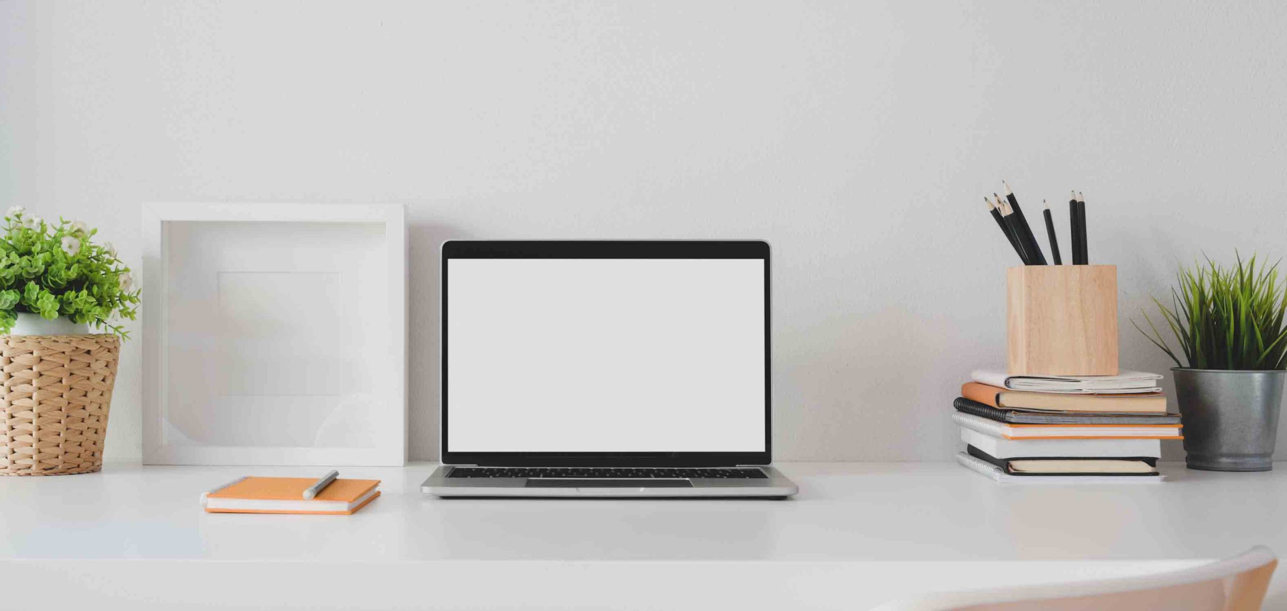 macbook-pro-on-white-table-3787308